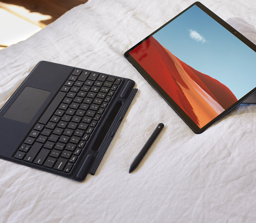 Surface Pro X with pen and keyboard.