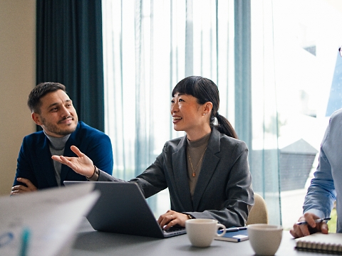 Azure Essentials: Three people discussing something in a working place