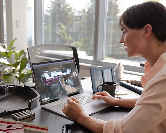 A person is working with laptop which is placed on the table