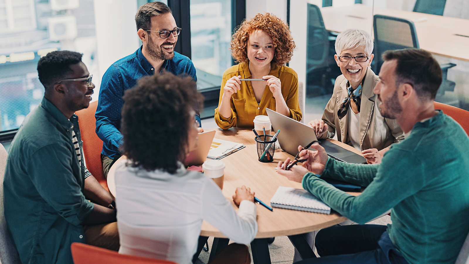 A group of people sitting around a table