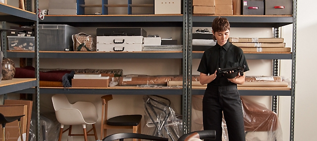 A girl in a black shirt working on tablet