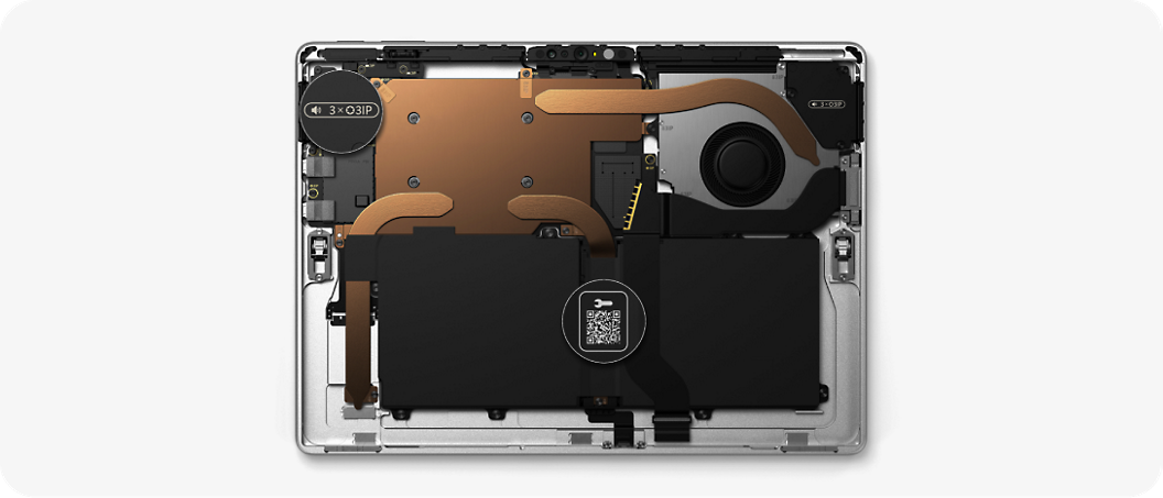 Internal view of a laptop showing components such as the battery, cooling system, and circuit board.