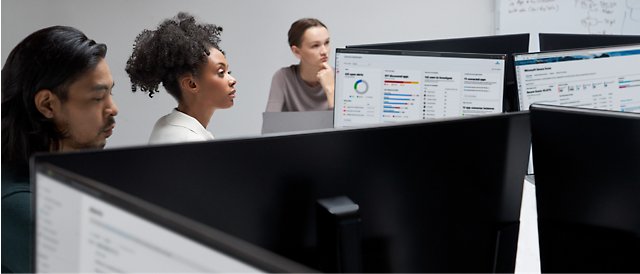 Group of people working on their desktops