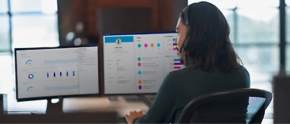 A person sitting in front of a computer