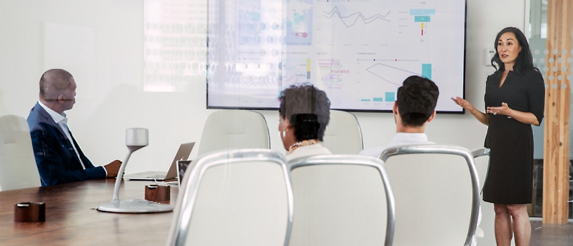 A group of people in a conference room.