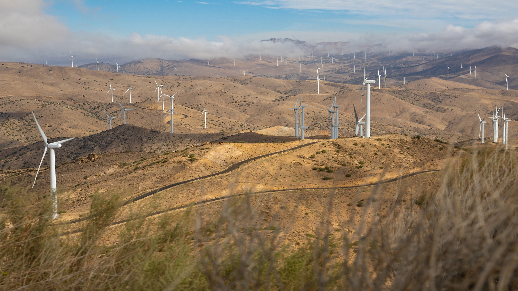 A wind turbines on a hill