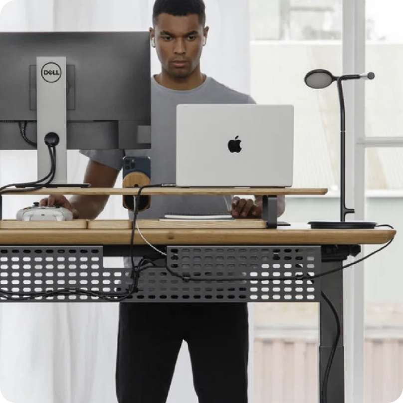 Image of a man working at a standing desk