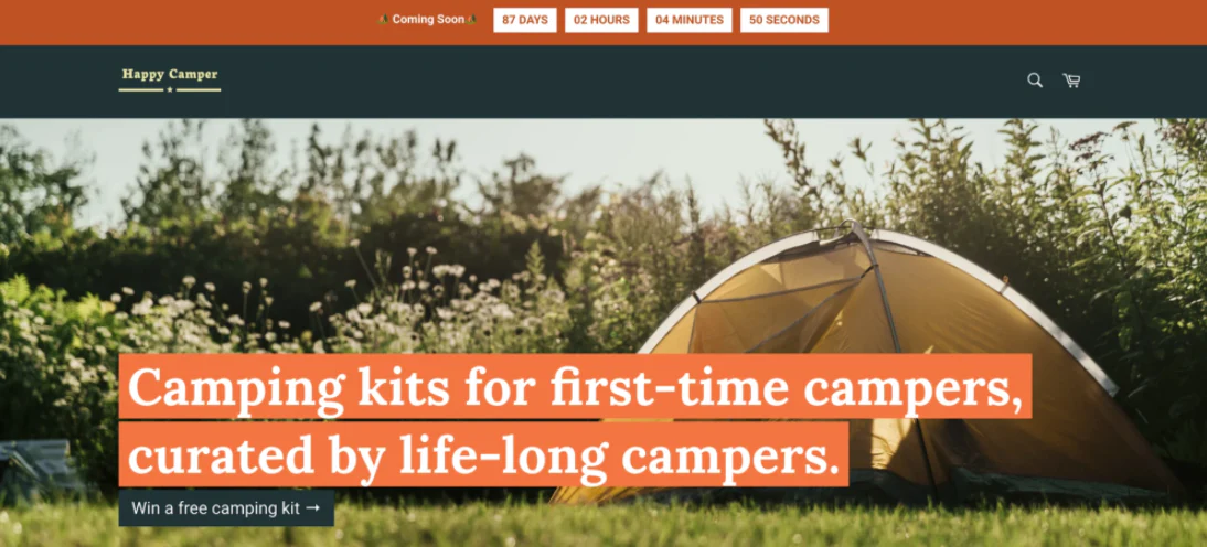 Happy Camper website with Coming Soon banner and countdown timer above photo of a tent