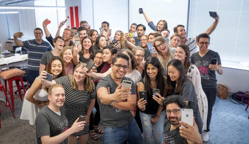 The Washington DC team energetically posing for a photo