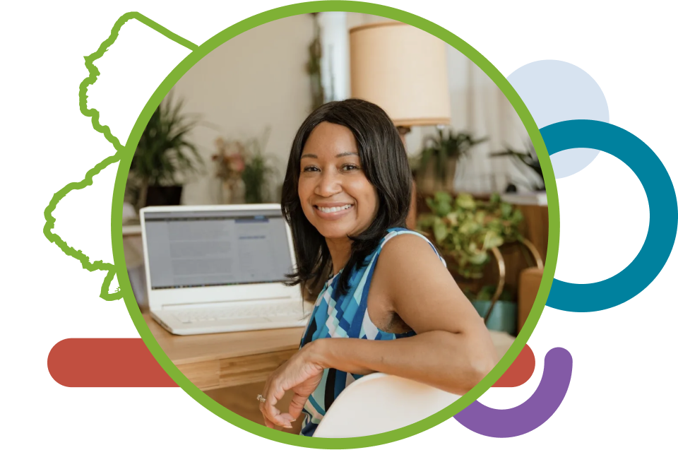 A female black entrepreneur smiles while registering her business.