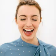 a woman smiling with open mouth