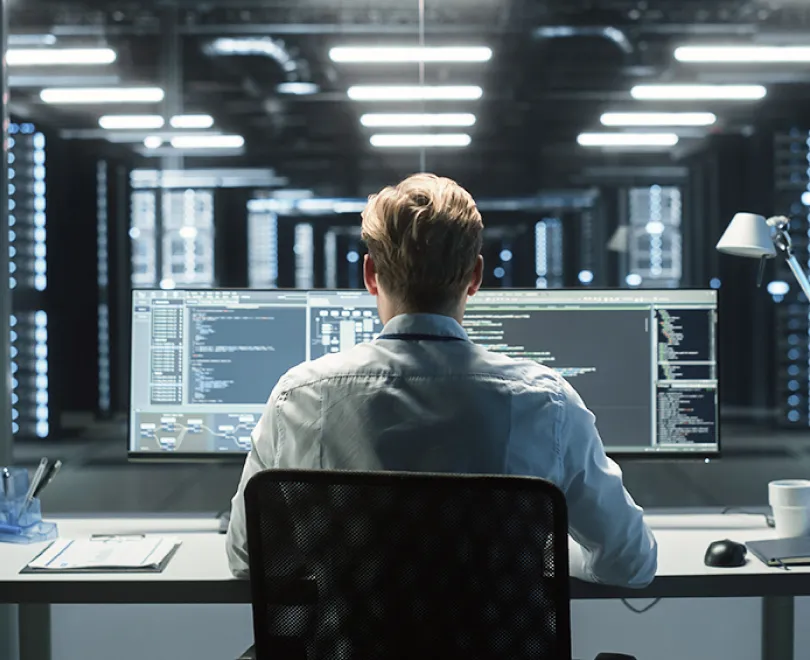 a person sitting at a desk and working