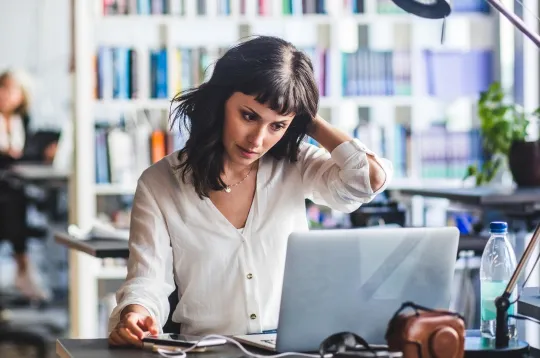 a woman working on her laptop