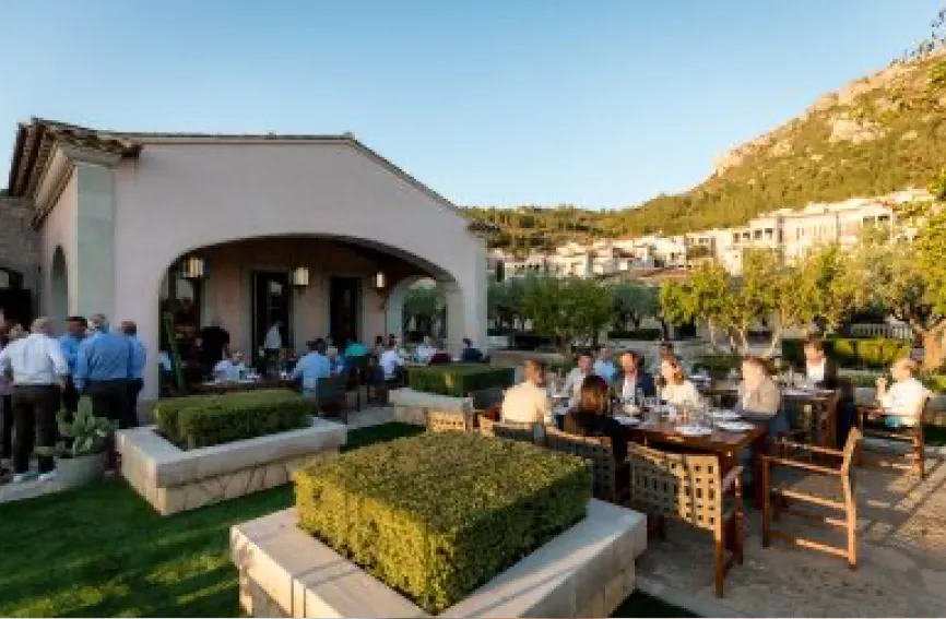 a group of people on a terrace at a restaurant