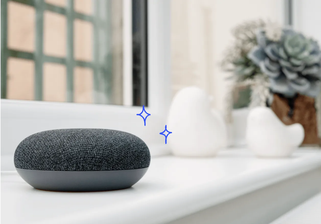 A smart speaker neatly placed on a shelf.