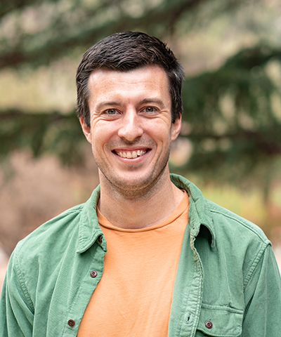 A headshot of Alden Keefe Sampson.