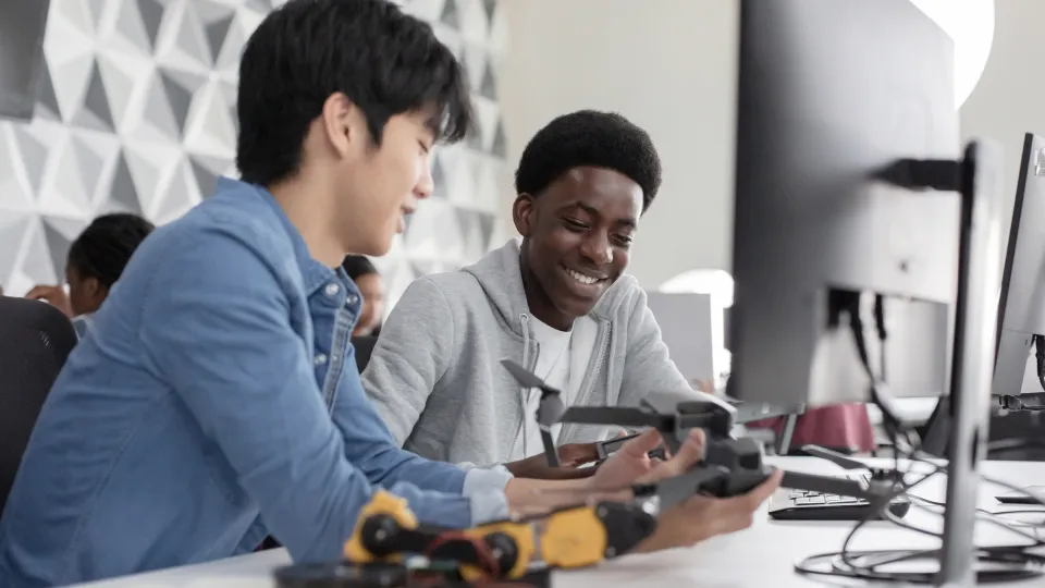 Students working with hi-tech gear in a modern classroom