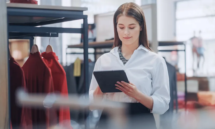 a woman looking at her tablet