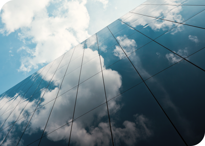 Clouds reflecting in building