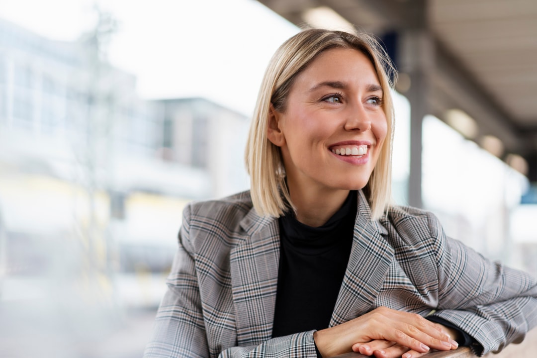 Woman smiling in a modern office