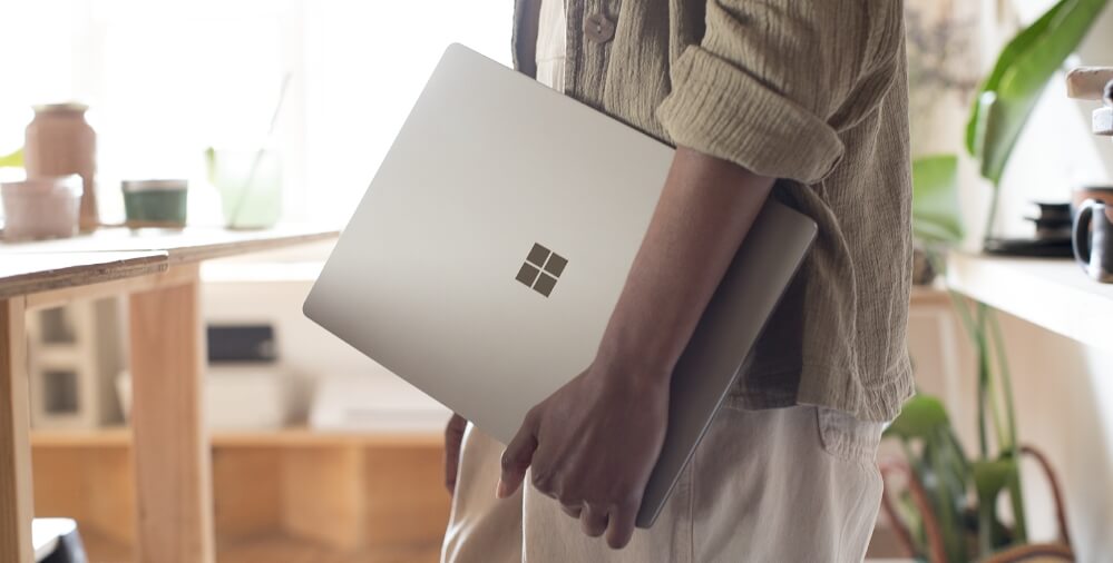 Woman holding a Windows 11 device