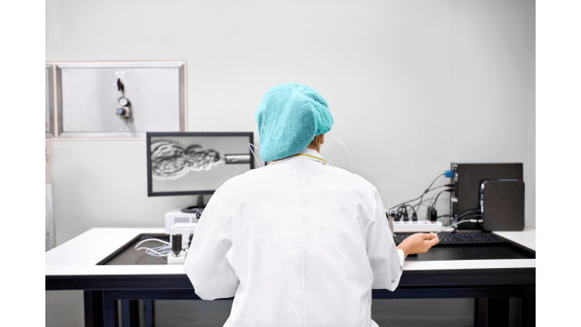 Laboratory technician performing in vitro fertilization.