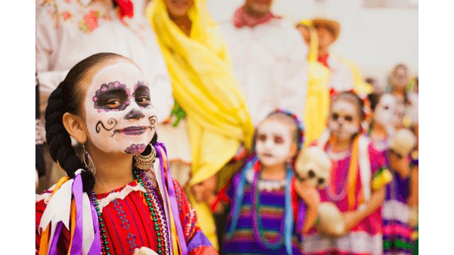 Hispanic children celebrating Dia de los Muertos.