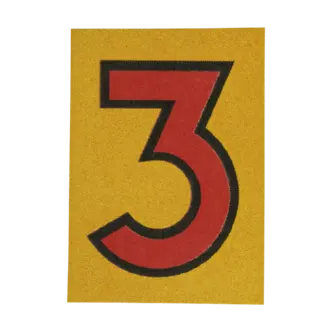 Number 3 sticker in cutout numbers.