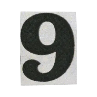 Number 9 sticker in cutout numbers.