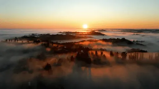 Foggy landscape at sunset