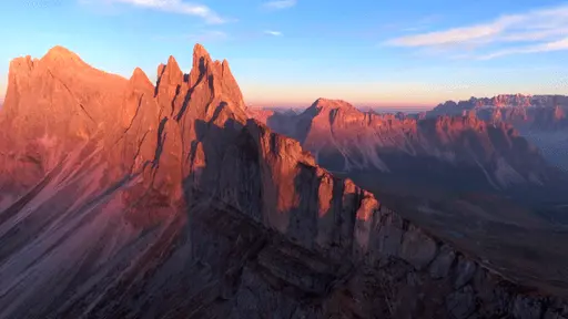 Aerial video of Seceda Mountain Range at dusk in the Dolomites, Italy