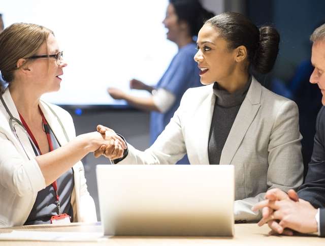 Legal professionals shaking hands