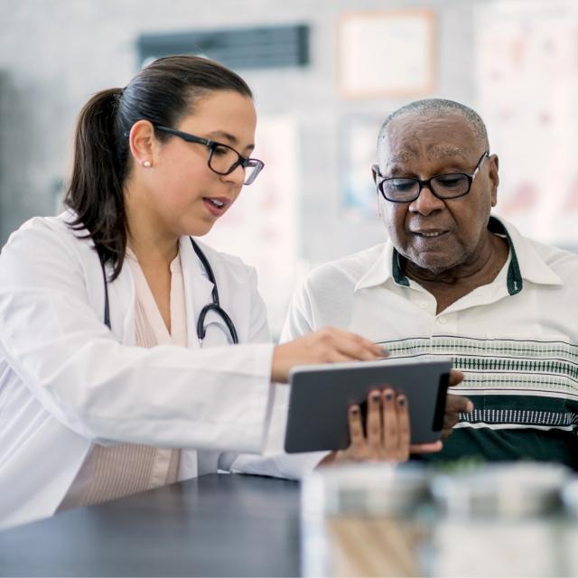 Nurse speaking to patient