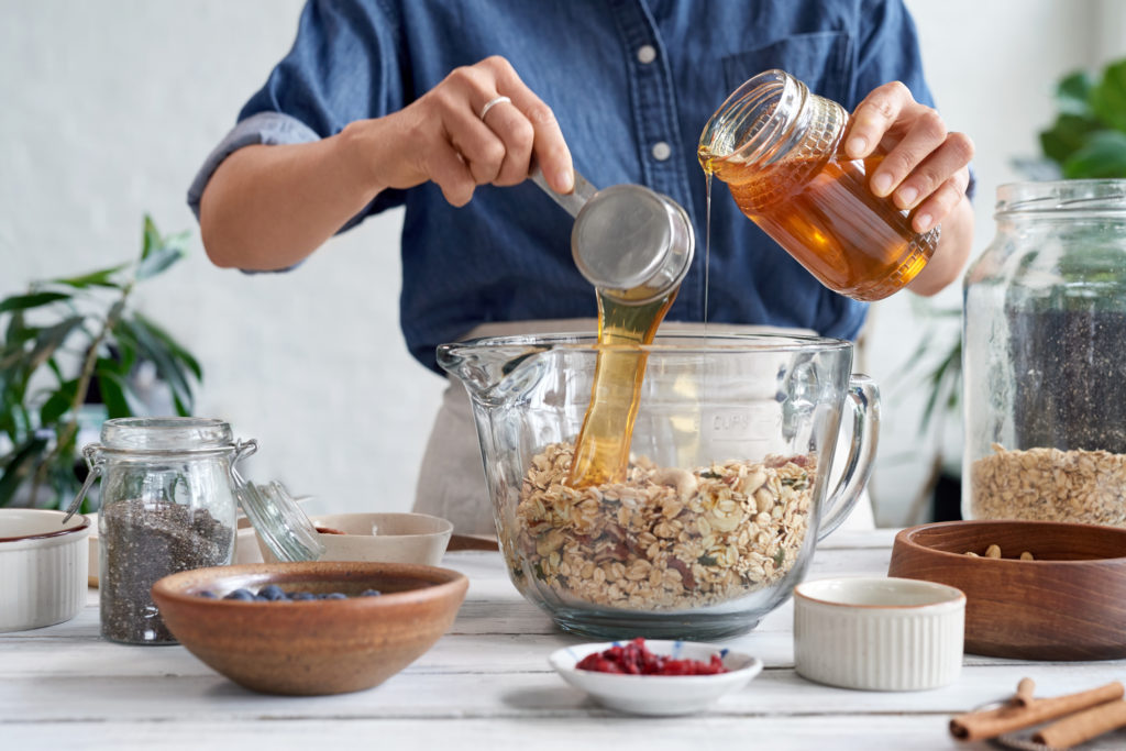 Woman At Home Making Homemade Granola