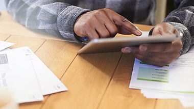 person handling a tablet