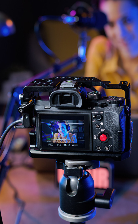 woman's phone visible on a camera screen