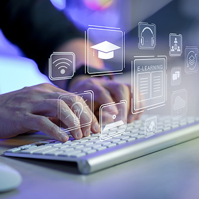 Close-up view of a person typing on a keyboard