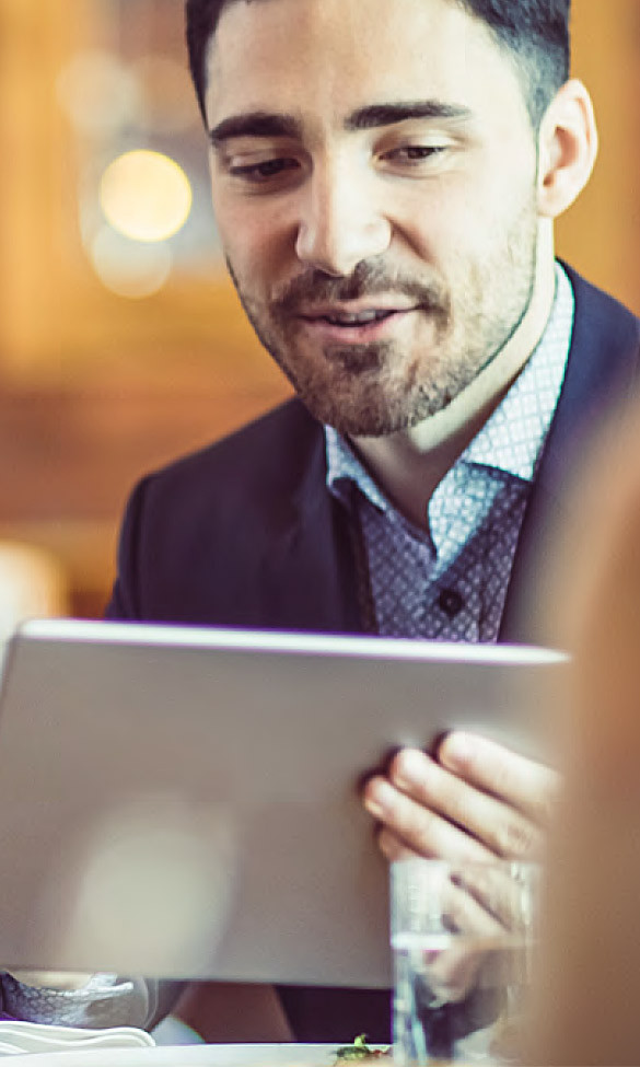 man staring at tablet