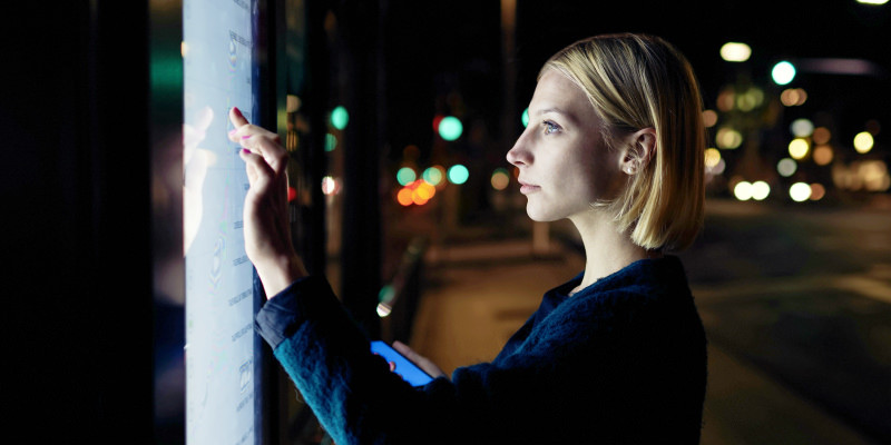 woman operating a screen