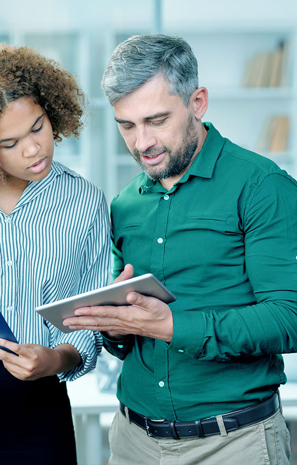 Man and woman looking at tablet screen