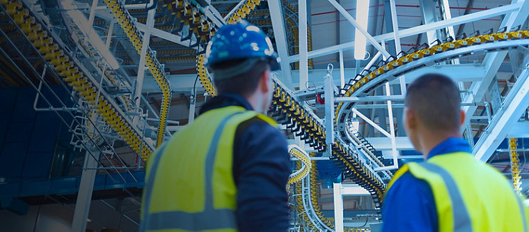 engineers overlooking manufacturing process