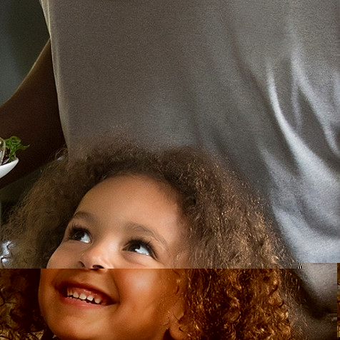 Young girl looking up and smiling