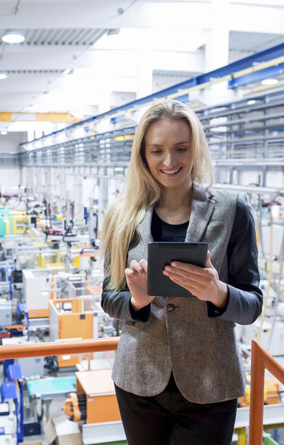 women studying tablet in industrial setting