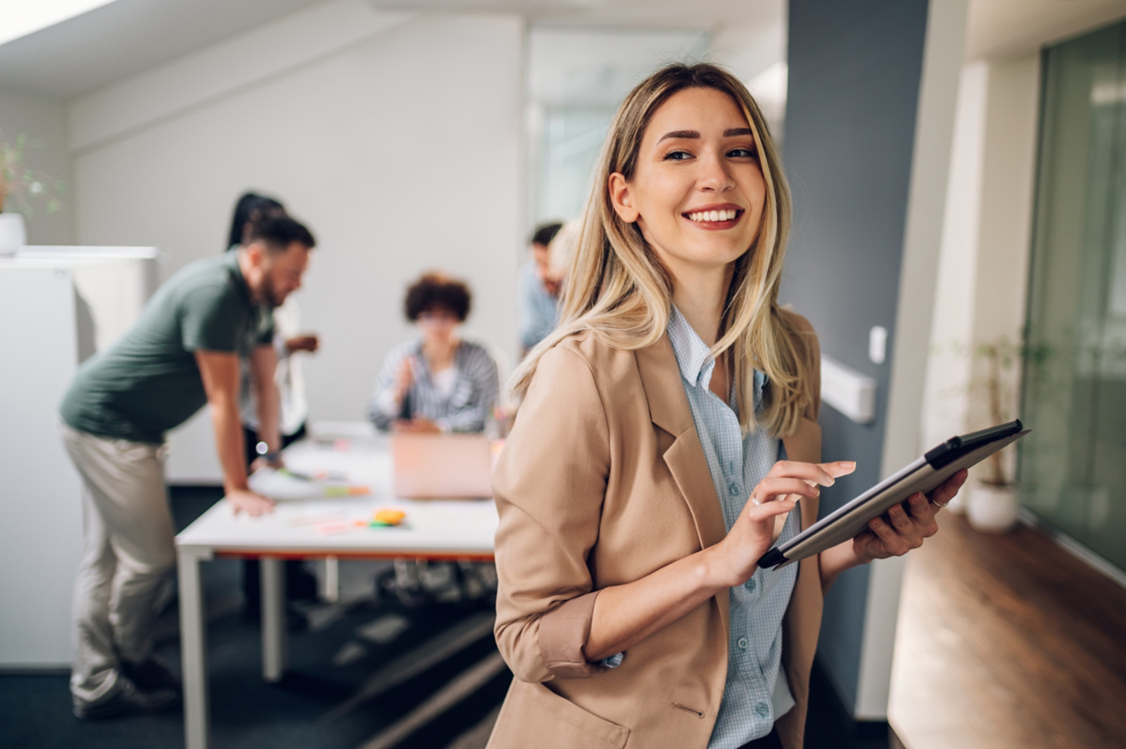 A woman with a tablet excited to do her work