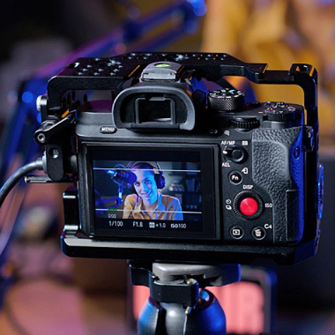 Looking at the back of a digital camera that shows an image of a woman speaking