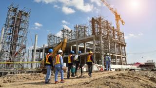 Construction workers at a building site.