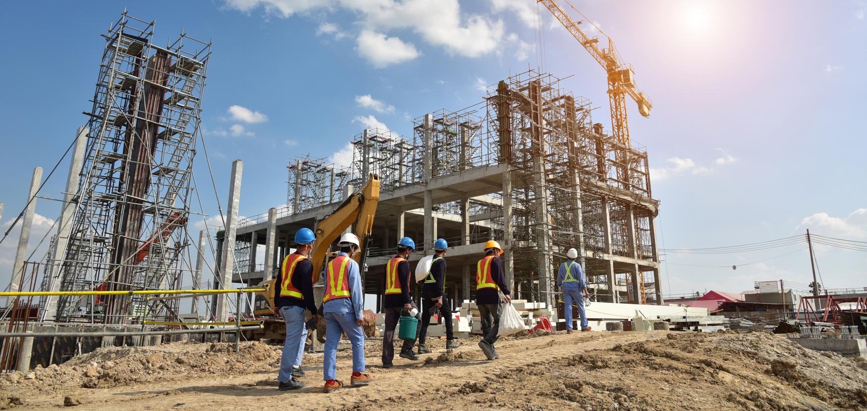 Construction workers at a building site.