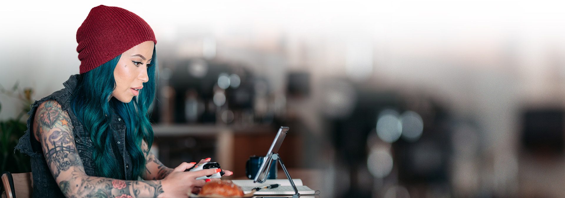 Woman playing a game on her phone with an Xbox controller