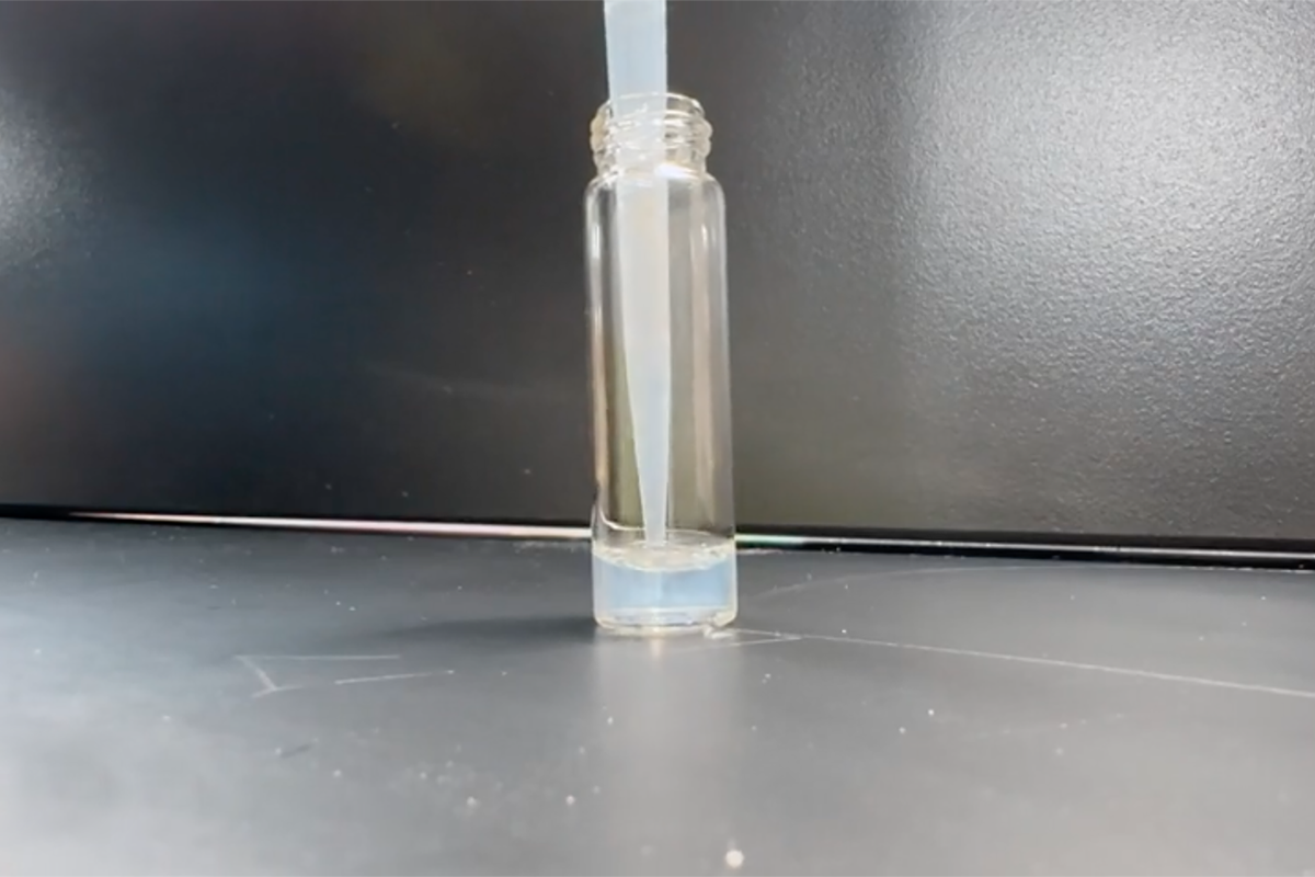 A test tube with a small amount of blue liquid