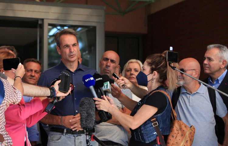 Greek Prime Minister Kyriakos Mitsotakis speaks to journalists in Greece in 2023.